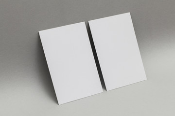 Blank white business card postcard flyer on a grey background