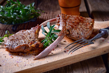 Grilled lamb chops  an old board