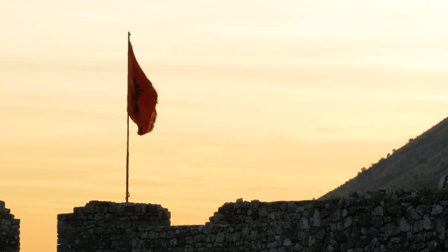 Shot from Rozafa Castle in Shkod&euml;r, Albania, dark flag with man
