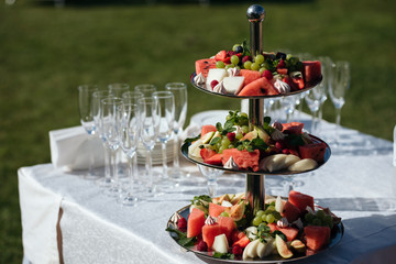 delicious fruit table with different sweets, for wedding reception, catering in restaurant - 188191359