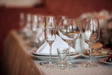 Empty glasses in restaurant on wedding table