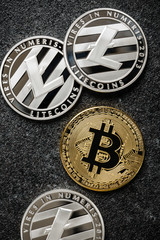 Bitcoin, Litecoin coins on black background
