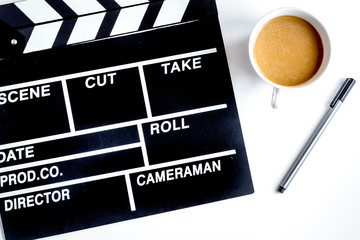 Screenwriter desktop with movie clapper board white background t