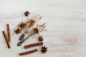 Spices for mulled wine cooking on the beautiful spoons