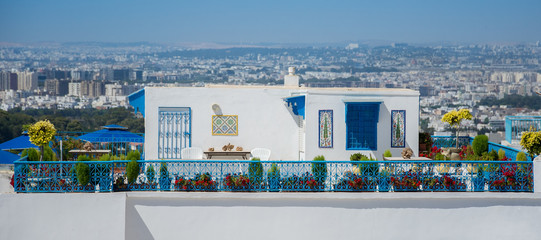 White house with blue windows with a beautiful terrace. Style Maghrib. Panoramic view of the...