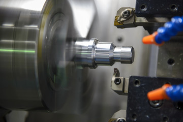 CNC lathe machine (Turning machine) cutting the metal  screw thread part  .Rotation of aluminium part.