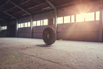 old lorry tire in the empty hangar