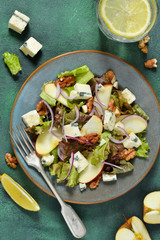 Vegetarian salad with blue cheese, apples and walnuts with mustard sauce.