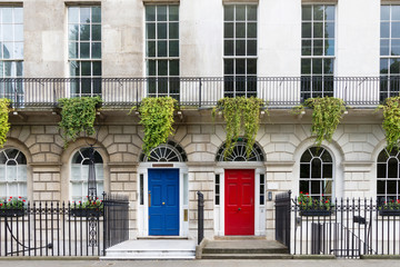 Fototapeta na wymiar Town house with red and blue door, London, UK