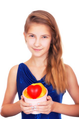 Valentine's day. Smiling beautiful teenage girl with a gift and a symbolic red heart