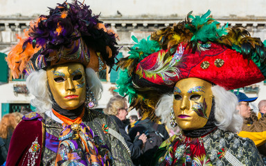 Couple in costumes and masks at the Carnival of Venice.