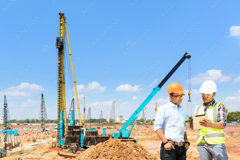 Wall mural Engineers are working at building sites.