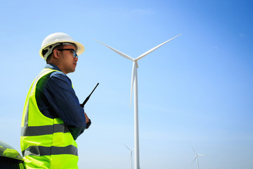Engineers are investigating the wind turbine.