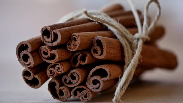 Cinnamon sticks background rope. 4k Close up shot, Slider equipment used. RL pan, Right slider dolly shot