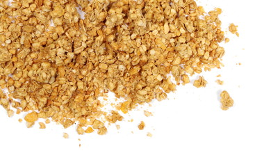 Crunchy granola, muesli pile with peanuts isolated on white background, top view