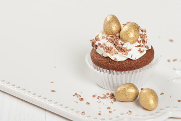 Easter Cupcake Decorated With Golden Chocolate Eggs. Home Baked.