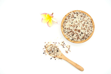 top view  Mixed White and brown rice in a wooden bowl and wooden spoon , colorful rice grain isolated  on White background .