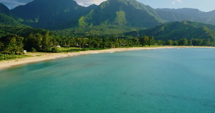 Cinematic aerial view of dramatic mountains and beautiful ocean, Hanalei Bay, Kauai, Hawaii