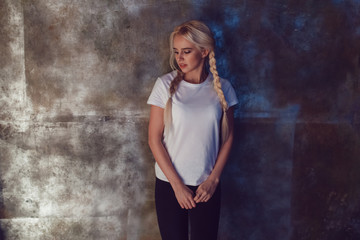 Beautiful girl with two braids in a white T-shirt. Mock-up.