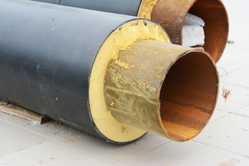 Close up on repair hot water supply system metal pipe insulation for better energy saving.