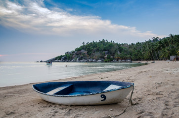 Beautiful beach with motor boat at toa island, Thailand