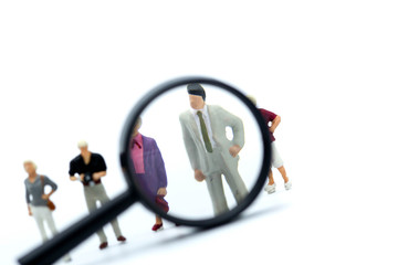 Miniature people :  business look for employees for job placement, using as background Choice of the best  employee, HR, HRM, HRD, job recruiter concepts.