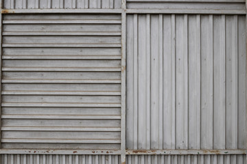 Obraz na płótnie Canvas Background image of a sheet of iron with a stripes pattern.