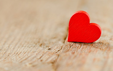 Heart on a wooden background. Background in the style of Valentine's Day. Heart on a wooden background
