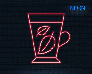 Neon light. Mint Tea line icon. Fresh herbal beverage sign. Mentha leaves symbol. Glowing graphic design. Brick wall. Vector