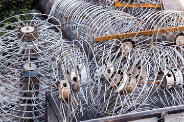 Old metal take up reel for film projector with stack overlapping a lot of.