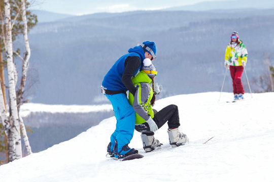 snowboarders on  ski resort