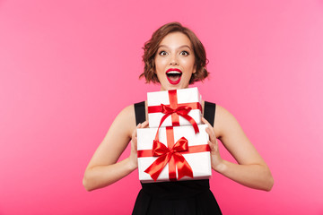 Fototapeta premium Portrait of a cheery girl dressed in dress