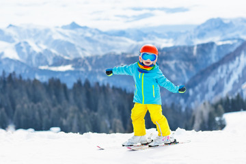 Fototapeta na wymiar Kids winter snow sport. Children ski. Family skiing.