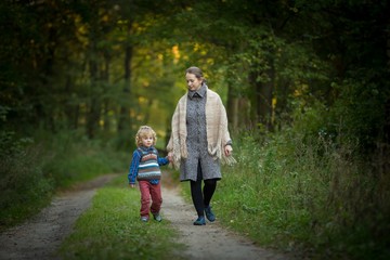 Fototapeta premium Mother and son together in forest