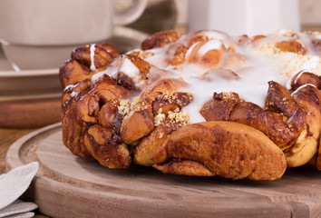 Closeup of Glazed Streusel Coffee Cake on a Wooden Platter