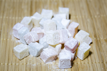 Turkish Delight in powdered sugar. Close-up, selective focus.