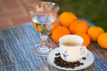 Natural fruits and cup of coffee for a beautiful morning whit the family in the garden