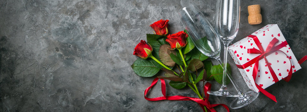 Valentine's day concept - presents, flowers and glasses