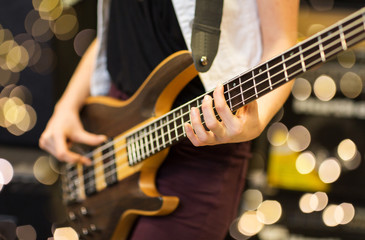 Obraz na płótnie Canvas close up of musician with guitar at music studio