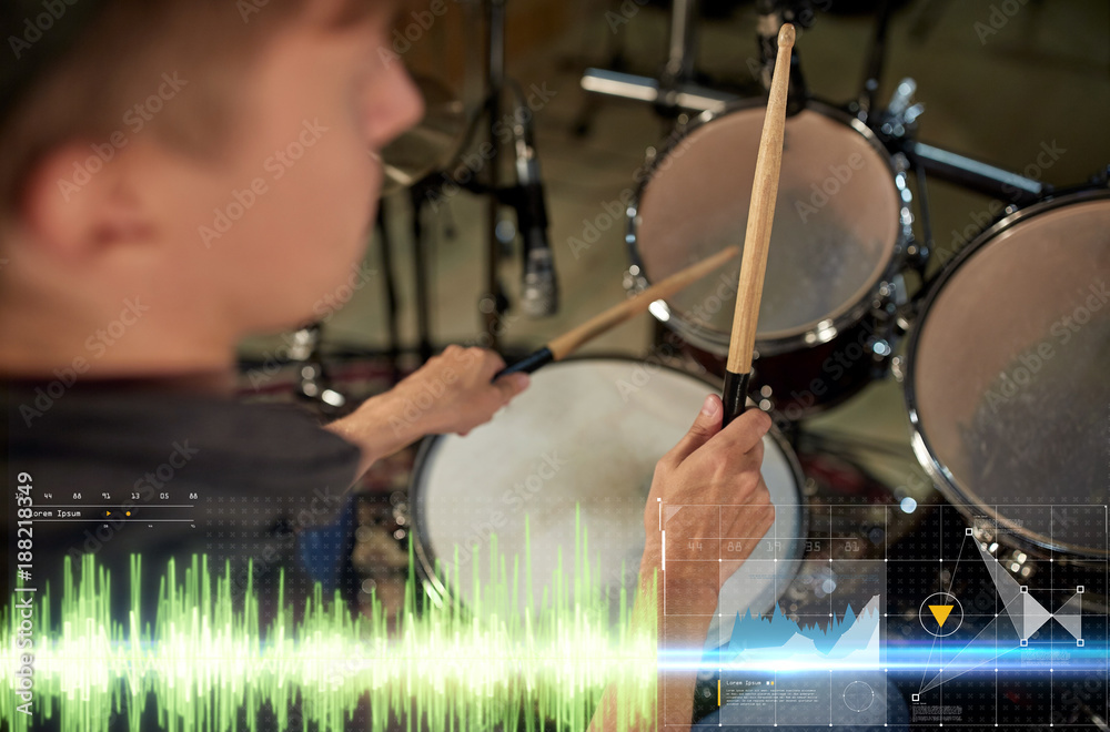 Wall mural male musician playing drum kit at concert