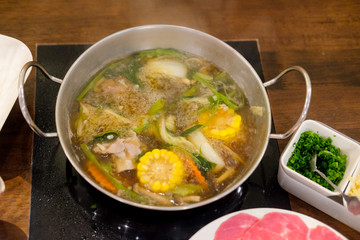 Cooking food by put a flesh beef pork and vegetable