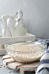 White beans soaked in water in a glass bowl