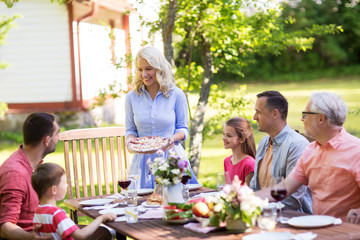 happy family having dinner or summer garden party