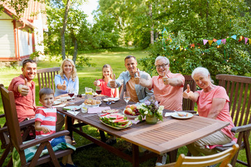 happy family having dinner or summer garden party
