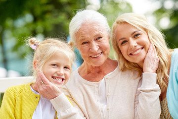 woman with daughter and senior mother at park