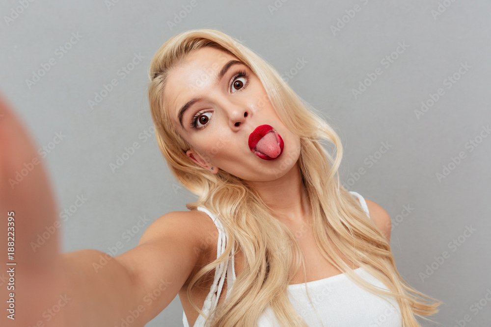 Sticker portrait of a funny girl taking a selfie