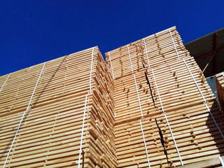 stack of wooden planks at the lumber yard