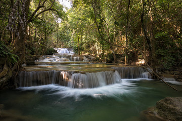 Fototapeta na wymiar Huay Maekamin Waterfall Tier 1 (Dong Wan or Herb Jungle) in Kanchanaburi, Thailand; photo by long exposure with slow speed shutter