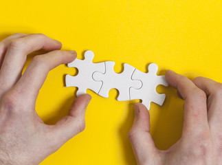 Jigsaw pieces being put together. Business solution concept