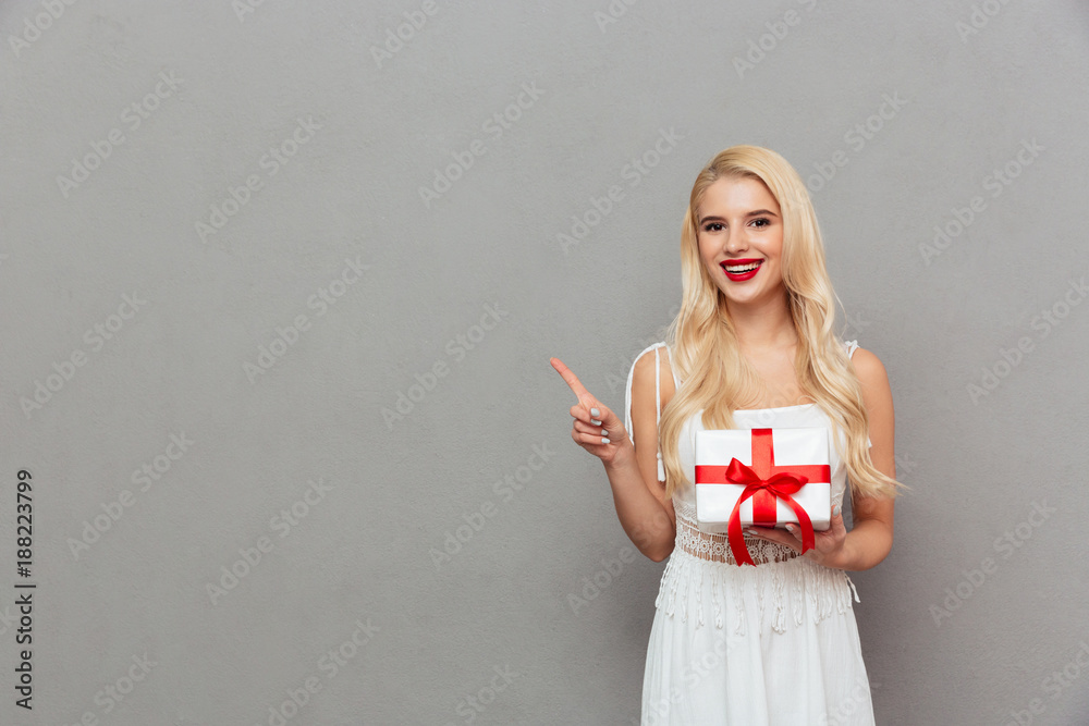 Sticker Portrait of a happy woman holding gift box